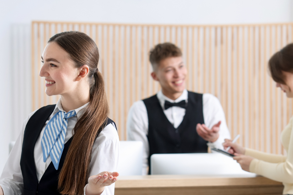 two hospitality accommodation team members in the workplace