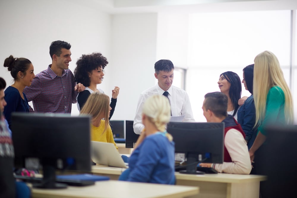 Group of students with a tutor learning and getting support