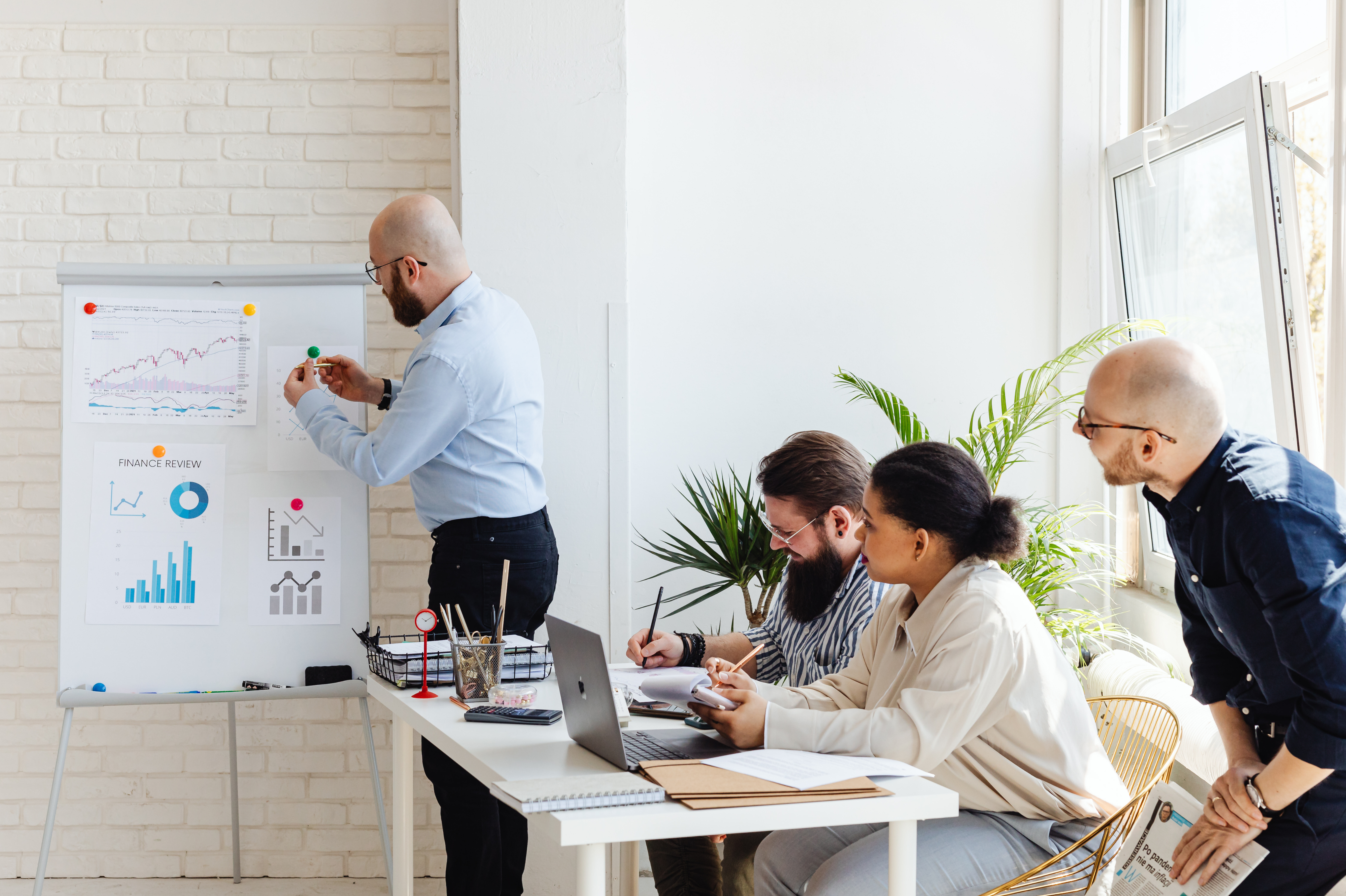 Team leader with a chart showing his coworkers